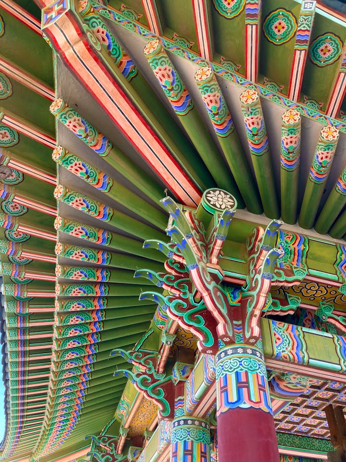 Close-up of a colorful and intricate Korean pavilion roof, showcasing detailed eaves in Los Angeles.